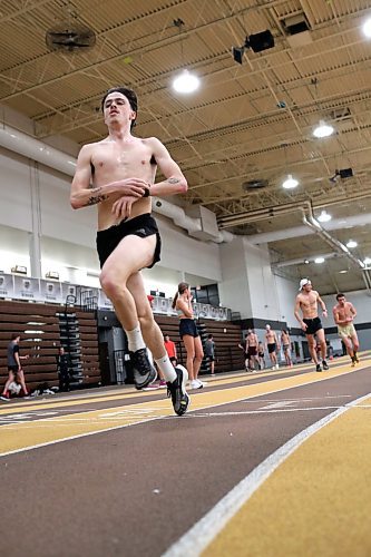 BROOK JONES / WINNIPEG FREE PRESS
University of Manitoba Bisons men's track &amp; field team middle distance runner Noel Kendle stops the chronograph on his wrist watch after completing a running interval while training on the track at the James Daly Fieldhouse at the University of Manitoba Fort Garry campus in Winnipeg, Man., Tuesday, Feb. 27, 2024. The Bisons men's team captured the Canada West Track &amp; Field Championships for the third year in a row. Kendle will be competing at the upcoming U Sports Track &amp; Field Championships his fourth year in a row.