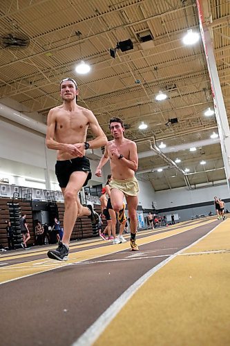 BROOK JONES / WINNIPEG FREE PRESS
University of Manitoba Bisons men's track &amp; field team middle and long distance runners Calvin Reimer (left) and Justin Kroeker train on the track at the James Daly Fieldhouse at the University of Manitoba Fort Garry campus in Winnipeg, Man., Tuesday, Feb. 27, 2024. The Bisons men's team captured the Canada West Track &amp; Field Championships for the third year in a row.