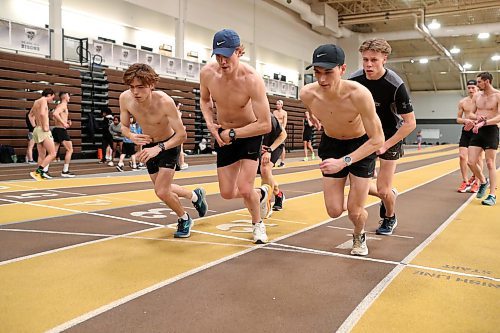 BROOK JONES / WINNIPEG FREE PRESS
University of Manitoba Bisons men's track &amp; field team middle and long distance runners Alejandro Civetta (far left), Tristan Allen (second from far left), Dawson Mann (right) and Keenan Allen (back right) train on the track at the James Daly Fieldhouse at the University of Manitoba Fort Garry campus in Winnipeg, Man., Tuesday, Feb. 27, 2024. The Bisons men's team captured the Canada West Track &amp; Field Championships for the third year in a row.
