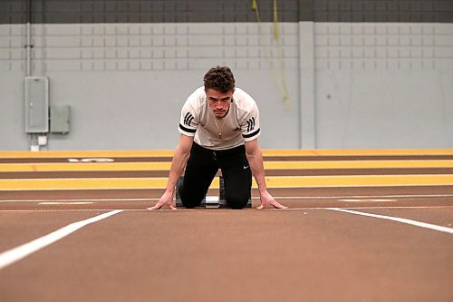 BROOK JONES / WINNIPEG FREE PRESS
University of Manitoba Bisons track &amp; field team sprinter Jordan Soufi focuses while in the starting blocks during a training session at the James Daly Fieldhouse at the University of Manitoba Fort Garry campus in Winnipeg, Man., Tuesday, Feb. 27, 2024. The Bisons men's team captured the Canada West Track &amp; Field Championships for the third year in a row.