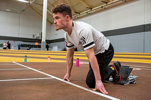 BROOK JONES / WINNIPEG FREE PRESS
University of Manitoba Bisons track &amp; field team sprinter Jordan Soufi focuses while in the starting blocks during a training session at the James Daly Fieldhouse at the University of Manitoba Fort Garry campus in Winnipeg, Man., Tuesday, Feb. 27, 2024. The Bisons men's team captured the Canada West Track &amp; Field Championships for the third year in a row.