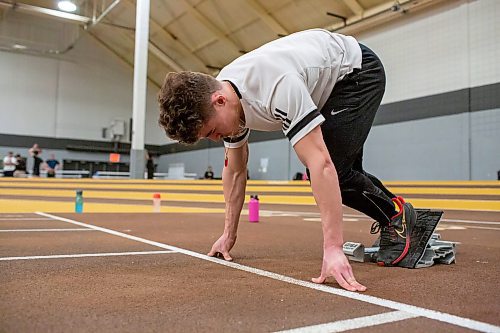 BROOK JONES / WINNIPEG FREE PRESS
University of Manitoba Bisons track &amp; field team sprinter Jordan Soufi is in the set position while in starting blocks during a training session at the James Daly Fieldhouse at the University of Manitoba Fort Garry campus in Winnipeg, Man., Tuesday, Feb. 27, 2024. The Bisons men's team captured the Canada West Track &amp; Field Championships for the third year in a row.