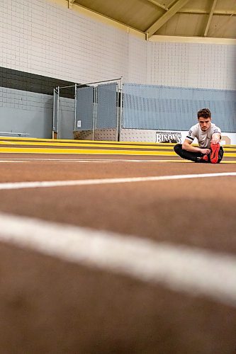 BROOK JONES / WINNIPEG FREE PRESS
University of Manitoba Bisons track &amp; field team sprinter Jordan Soufi stretches during a training session at the James Daly Fieldhouse at the University of Manitoba Fort Garry campus in Winnipeg, Man., Tuesday, Feb. 27, 2024. The Bisons men's team captured the Canada West Track &amp; Field Championships for the third year in a row.