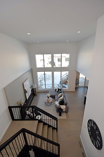 Todd Lewys / Winnipeg Free Press
It's a pleasure to look down on the great room of this stunning Bison Run two-storey. 