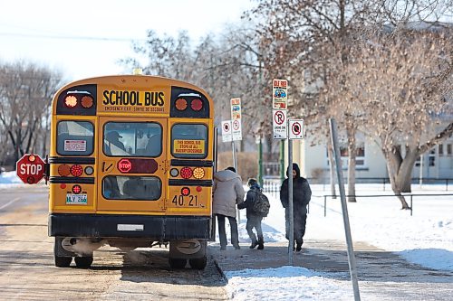 A student boards a school bus at École New Era School at 527 Louise Ave. in Brandon on Wednesday afternoon. (Abiola Odutola/The Brandon Sun)