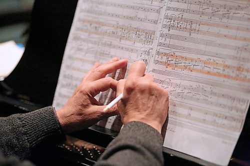 Brandon University musical instructor and pianist Alexander Tselyakov makes notes on his musical score during a rehearsal with fellow musician Megumi Masaki on Wednesday afternoon for a performance on Saturday evening at the Lorne Watson Recital Hall. (Matt Goerzen/The Brandon Sun)