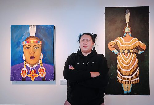 Brandon University fine arts student Cassidy McDonald poses with her self portraits on Thursday afternoon, part of the Indigenous Art: Beyond History exhibit at the Glen P. Sutherland Gallery of Art on Victoria Avenue.  The exhibit opens to the public this evening between 7-9 p.m.and will be on display until March 15. (Matt Goerzen/The Brandon Sun)