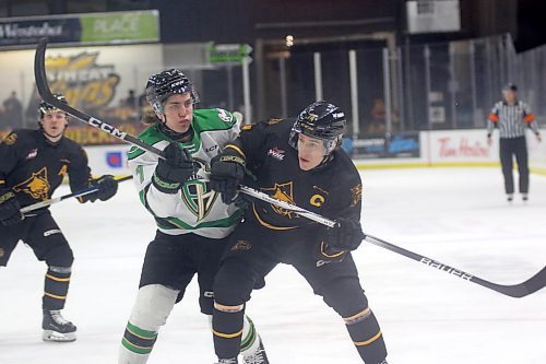 Brandon Wheat Kings captain Brett Hyland and Prince Albert Raiders Justice Christensen fight over a loose puck during their Western Hockey League game at Westoba Place on Friday. (Thomas Friesen/The Brandon Sun)