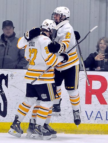 Brandon Wheat Kings forward Cole Dupuis (27) is jumped on by teammates after scoring his first period shorthanded goal on Eastman Selects goalie Samuel Fontaine in Game 1 at J&G Homes Arena Friday night. The Wheat Kings went on to prevail 10-2 to open their Manitoba U18 AAA Hockey League post-season. (Jules Xavier/The Brandon Sun)