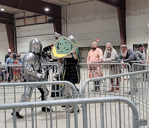 Two knights battle each other as Viking re-enactors look on at the Westman Gaming Expo, held over the weekend of March 2 and 3 at the Keystone Centre in Brandon. (Miranda Leybourne/The Brandon Sun)