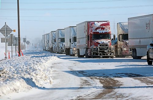 Westbound semi trucks were lined up along the Trans-Canada Highway at the First Street intersection on Monday morning as drivers waited for highways to reopen. (Matt Goerzen/The Brandon Sun)