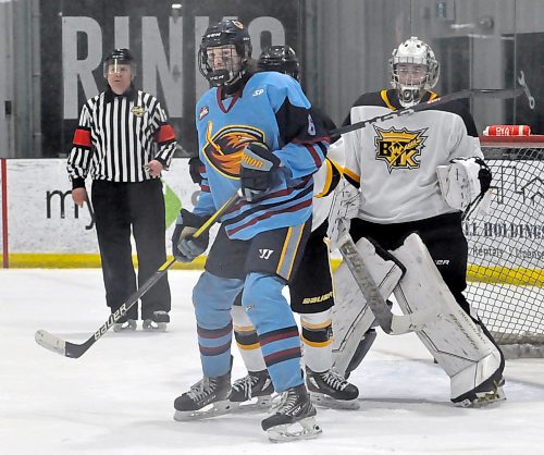 The Brandon Wheat Kings goaltending tandem of Brady Low and Brady Shields kept Winnipeg Thrashers forwards like Carter Green (8) at bay after they took a 2-0 lead in the best-of-five U17 AAA playoff series. They were stellar in net as their teammates won the next three games to stave off elimination. (Jules Xavier/The Brandon Sun)