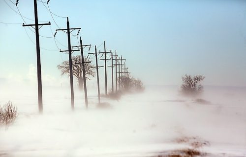 Blowing winds on Monday afternoon, following the weekend blizzard, made travel outside of the city of Brandon treacherous, including along this gravel road southeast of the community of Forrest. (Matt Goerzen/The Brandon Sun)
