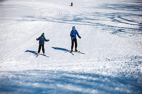 MIKAELA MACKENZIE / FREE PRESS

Coen (left, eight) and Maelle (11) Enns ski on a sunny, snowy day at Windsor Park Nordic Centre on Tuesday, March 5, 2024. 

Standup.