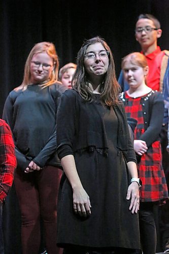St. Augustine School music teacher Janelle Wilts stands before her grade 5/6 choir shortly before they perform for the Brandon Festival of the Arts program at the Western Manitoba Centennial Auditorium on Tuesday afternoon. (Matt Goerzen/The Brandon Sun)