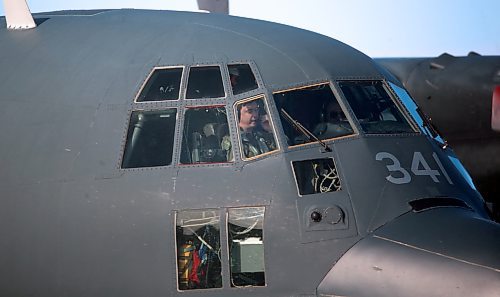 The pilot of a C-130 Hercules aircraft flies speaks into his headset while stopped at the Brandon Municipal Airport during a routine training session. (Matt Goerzen/The Brandon Sun)