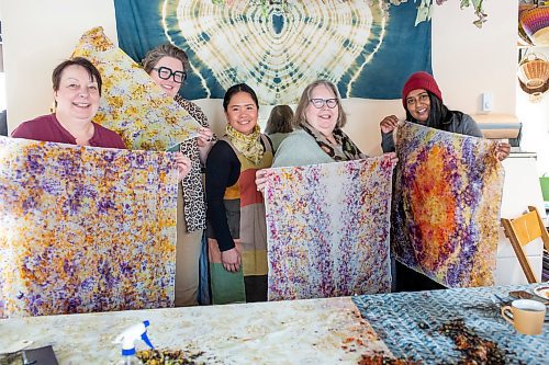 BROOK JONES / FREE PRESS
Lourdes Still (middle), who is the founder of Masagana Flower Farm, hosted a tinta experience workshop where participants were taught how to dye wearable fabric art at her studio in the RM of Ste. Anne, Man., Saturday, Feb. 24, 2024. Pictured: Workshop participants Karie Esner Mooney (far left) from Portage la Prairie, Hillary Dux (second from far left) and her mother Colleen Dux (second from far right) who are both from Winnipeg, and Free Press arts &amp; life writer AV Kitching (far right) show off the silk bandanas they dyed with various colours by using dried flower blooms.