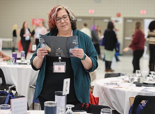 Polly Schoonbaert from Workforce Training and Employment Services with the Manitoba Government looks over the day's agenda. (Michele McDougall/The Brandon Sun)
