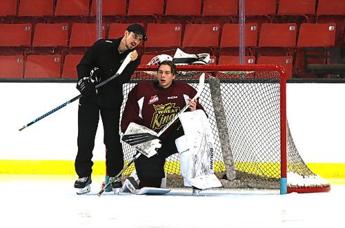 Colin McGill, shown with Brandon Wheat Kings goalie Ethan Eskit during a practice earlier this season, also serves as the director of goalie development at the Western Canada Hockey Academy. (Perry Bergson/The Brandon Sun)