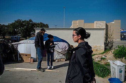 Callaghan O'Hare / FREE PRESS

Fryda Ochoa, a communications specialist with the Coalition for the Homeless, visits Slim, who lives in a makeshift structure adjacent to a gas station, on Wednesday, February 14, 2024, in Houston, Texas. Houston has had significant success in getting people who were once homeless into housing, which prompted a visit from Winnipeg&#x2019;s mayor in September of 2023 to see what lessons could be learned.