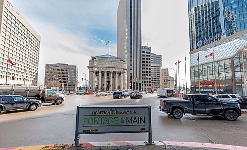 MIKE DEAL / FREE PRESS
Traffic at Portage Avenue and Main Street.
See Malak Abas story. 
240301 - Friday, March 01, 2024.