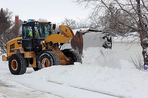 A City of Brandon front end loader drops snow collected from an east-end road on Thursday afternoon. A snow storm the previous night dropped 16 centimeters of snow on the city, closed schools in multiple Westman divisions and stranded some motorists after Highway 1 was closed. (Colin Slark/The Brandon Sun)