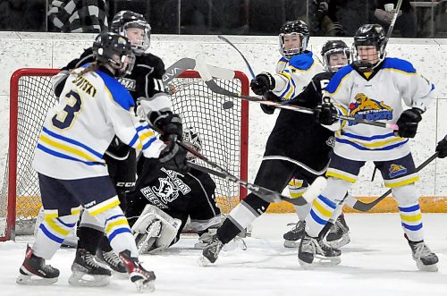 Crease action during Game 1 in front of the Eastman Selects net often resembled a rugby scrum as the visiting team collapsed in front of their goalie Addison Tomes. Here, the Wildcats look to deflect a rare shot making its way from the point with their sticks as Tomes eyes it while out of position on the ice. (Jules Xavier/The Brandon Sun)