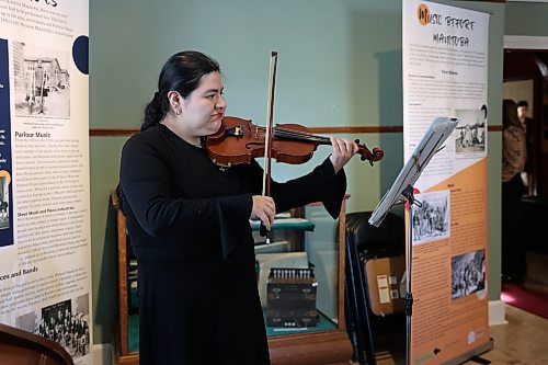 Local violinist Rocio Luna, plays a tune during the grand opening of "The Sound of History" exhibit at the Daly House Museum. (Geena Mortfield/The Brandon Sun)