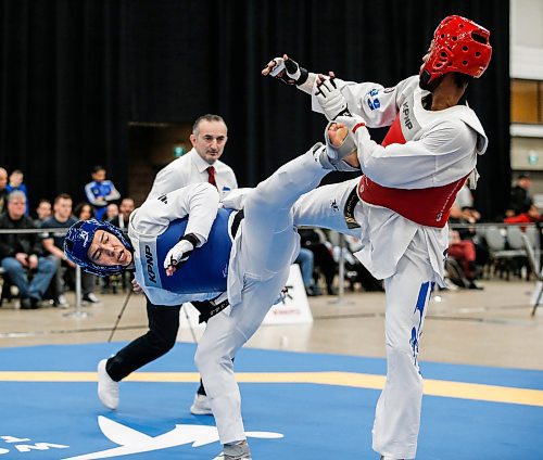 JOHN WOODS / FREE PRESS
Tae ku Park (TRP Academy)(blue) competes against  Aurele tcheh Nde (Taekwondo Longueuil)(red) in the 68kg - 74kg mens final at the National Taekwondo Championships in Winnipeg&#x2019;s Convention Centre Sunday, March 10, 2024. 

Reporter: ?