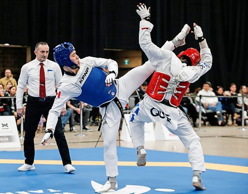 JOHN WOODS / FREE PRESS
Tae ku Park (TRP Academy)(blue) competes against  Aurele tcheh Nde (Taekwondo Longueuil)(red) in the 68kg - 74kg mens final at the National Taekwondo Championships in Winnipeg&#x2019;s Convention Centre Sunday, March 10, 2024. 

Reporter: ?