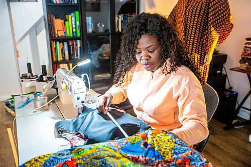 MIKAELA MACKENZIE / FREE PRESS

Oluwayemisi Josephine Ogunwale works on the bodice of a dress in her home studio on Monday, March 11, 2024. Ogunwale is a dressmaker who specializes in making custom-made outfits using Nigerian textiles.

For AV story.