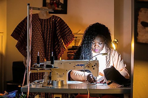 MIKAELA MACKENZIE / FREE PRESS

Oluwayemisi Josephine Ogunwale works on the bodice of a dress in her home studio on Monday, March 11, 2024. Ogunwale is a dressmaker who specializes in making custom-made outfits using Nigerian textiles.

For AV story.