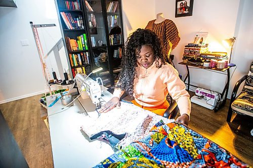 MIKAELA MACKENZIE / FREE PRESS

Oluwayemisi Josephine Ogunwale works on the bodice of a dress in her home studio on Monday, March 11, 2024. Ogunwale is a dressmaker who specializes in making custom-made outfits using Nigerian textiles.

For AV story.