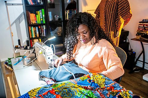 MIKAELA MACKENZIE / FREE PRESS

Oluwayemisi Josephine Ogunwale works on the bodice of a dress in her home studio on Monday, March 11, 2024. Ogunwale is a dressmaker who specializes in making custom-made outfits using Nigerian textiles.

For AV story.