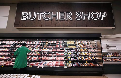 An employee stocks the butcher shop shelves in the newly upgraded Sobeys West grocery store in Brandon. (Matt Goerzen/The Brandon Sun)