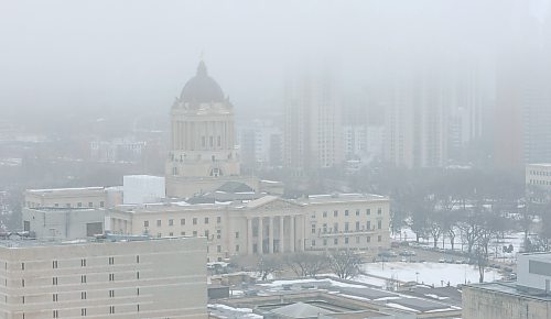 MIKE DEAL / WINNIPEG FREE PRESS
The Manitoba Legislative Building is shrouded in fog as seen from the 21st floor of the new headquarters for Wawanesa Insurance at 236 Carlton St., at True North Square, in downtown Winnipeg, Wednesday morning.
240313 - Wednesday, March 13, 2024.