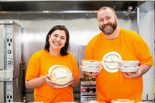 MIKAELA MACKENZIE / FREE PRESS

Marli Cordella (left) and Giuliano Roveri, owners of Brazilicious, with freshly made chicken pies in their commercial kitchen in Winnipeg on Wednesday, March 13, 2024.  They both hail from Sao Paulo, Brazil, and started a food biz in November offering a taste of home.

For Dave Sanderson story.