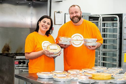 MIKAELA MACKENZIE / FREE PRESS

Marli Cordella (left) and Giuliano Roveri, owners of Brazilicious, with freshly made chicken pies in their commercial kitchen in Winnipeg on Wednesday, March 13, 2024.  They both hail from Sao Paulo, Brazil, and started a food biz in November offering a taste of home.

For Dave Sanderson story.