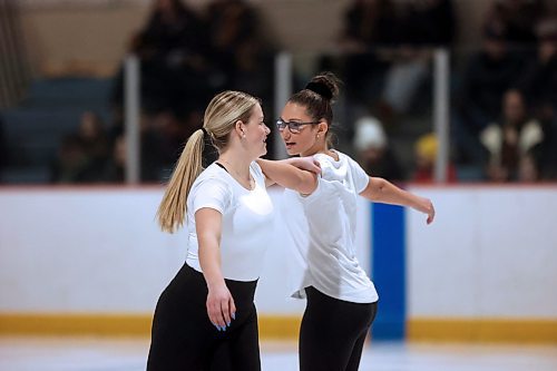 Ella Young, left, and Jacy Butler finish a spin in the Star 3 &amp; Up category while skating to the song 9 to 5 on Tuesday evening at Flynn Arena. (Matt Goerzen/The Brandon Sun)