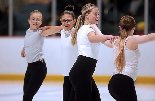Teagan Guenther, from left, Ella Young, Jacy Butler and Mhairi Crawford finish a spin in the Star 3 &amp; Up category while skating to the song 9 to 5 on Tuesday evening at Flynn Arena. (Matt Goerzen/The Brandon Sun)