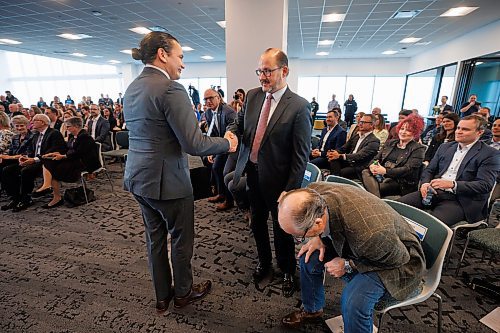 MIKE DEAL / WINNIPEG FREE PRESS
Manitoba Premier, Wab Kinew, shakes hands with Wawanesa's CEO, Jeff Goy, during the opening of the new Wawanesa Insurance headquarters at 236 Carlton St., at True North Square, in downtown Winnipeg, Wednesday morning.
240313 - Wednesday, March 13, 2024.