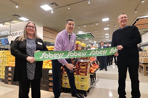 Sobeys West Store Manager Janice Kirwan, Franchisee/manager Greg Gingras and Co-owner Jeffery Nakoneshny during the ribbon-cutting at the Sobeys Brandon West on Thursday morning. Gingras says the store unveiled a host of new additions and improvements aimed at enhancing the shopping experience for customers. PHOTOS: Abiola Odutola/The Brandon Sun