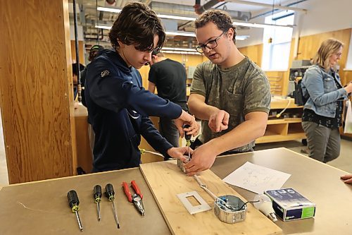 Hamiota Collegiate Student Keegan Rempel and ACC Pre-employment student Levi Hiebert. Rempel has first-hand experience with Switch and Light exercises at the Construction Electrician department during the Trade Summit on Thursday. Photos: Abiola Odutola/The Brandon Sun.