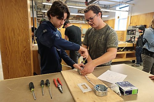 Hamiota Collegiate student Keegan Rempel and ACC pre-employment student Levi Hiebert are focused on the task as Rempel gets firsthand experience with switch and light exercises in the construction electrician department during the Trades Summit on Thursday. (Abiola Odutola/The Brandon Sun)