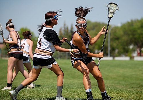 JOHN WOODS / WINNIPEG FREE PRESS
Laylah Laquette-Koch, left, defends against Payton Cvetkovic during the female lacrosse day at Shaughnessy Park Sunday, May 28, 2023. 

Re: josh