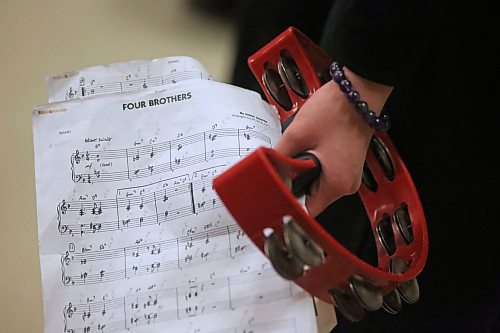 A young woman with iJazz from Maples Collegiate in Winnipeg holds a tamborine and a musical score for Four Brothers by Jimmy Giuffre on Friday afternoon. The grades 10-12 student band peformed at 2 p.m. at the Lorne Watson Recital Hall at Brandon University, part of the institution's three-day Jazz Festival. (Matt Goerzen/The Brandon Sun)