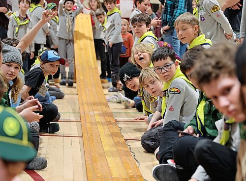 Beavers, Cubs, and Scouts from Westman sit trackside and cheer on the handmade wooden cars, during the races at the Kubkar Regional Rally held at Ecole New Era School gym on Saturday. Prizes were awarded for the fastest as well as best design. (Michele McDougall/The Brandon Sun)