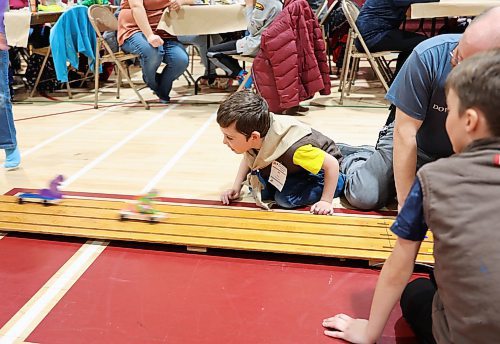 Five year old Alexander Foreman, a Beaver from Virden, cheers for his car in the Kubkar Regional Rally held at Ecole New Era School gym on Saturday. Beavers, Cubs, and Scouts from Westman entered their handmade wooden cars, with prizes were awarded for the fastest as well as best design. (Michele McDougall/The Brandon Sun)