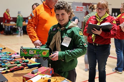Eleven year old Max Davidson, a Scout from Reston, shows off his handmade semi - his entry in the Kubkar Regional Rally held at Ecole New Era School gym on Saturday. Prizes were awarded for the fastest as well as best design. (Michele McDougall/The Brandon Sun)