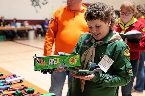 Eleven year old Max Davidson, a Scout from Reston, shows off his handmade semi - his entry in the Kubkar Regional Rally held at Ecole New Era School gym on Saturday. Prizes were awarded for the fastest as well as best design. (Michele McDougall/The Brandon Sun)